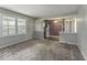 Bright living room featuring large windows and neutral tones, ideal for comfortable living at 3134 W Hickory Woods Dr, Greenfield, IN 46140