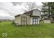 Outbuilding features a large door, with a smaller shed in the background at 3134 W Hickory Woods Dr, Greenfield, IN 46140