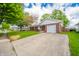 Brick home featuring an attached one car garage with a large concrete driveway for parking at 331 W 5Th St, Lapel, IN 46051