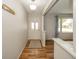 Inviting entryway featuring hardwood floors, a coat rack, and a view into the brightly lit living room at 331 W 5Th St, Lapel, IN 46051