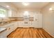 Well-lit kitchen with white cabinetry, granite countertops, and modern appliances at 331 W 5Th St, Lapel, IN 46051