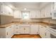 Bright kitchen featuring white cabinetry, updated countertops and stainless steel sink at 331 W 5Th St, Lapel, IN 46051