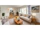 Cozy living room with hardwood floors, comfortable seating, and a view to the entryway at 331 W 5Th St, Lapel, IN 46051