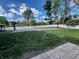 Spacious backyard with a well-maintained lawn and a basketball court, perfect for outdoor activities at 3401 W Kessler Blvd N Dr, Indianapolis, IN 46222