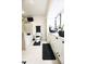 Modern bathroom features a double vanity, black fixtures, and a separate tub at 3401 W Kessler Blvd N Dr, Indianapolis, IN 46222