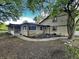 Home exterior with trees, stone and siding, neutral colors, and a covered front porch at 3401 W Kessler Blvd N Dr, Indianapolis, IN 46222