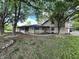 Home exterior with trees, stone and siding, neutral colors, and a covered front porch at 3401 W Kessler Blvd N Dr, Indianapolis, IN 46222