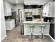 Modern kitchen boasting updated appliances, granite counters, bar seating and lots of natural light at 3401 W Kessler Blvd N Dr, Indianapolis, IN 46222