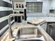 Close-up of the kitchen sink, granite countertop, stainless steel faucet, and striped window blind detail at 3401 W Kessler Blvd N Dr, Indianapolis, IN 46222