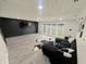Spacious living area featuring a modern accent wall, plush seating, and an abundance of natural light at 3401 W Kessler Blvd N Dr, Indianapolis, IN 46222