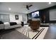 Contemporary main bedroom featuring a modern chair, sleek fireplace, and stylish decor at 3401 W Kessler Blvd N Dr, Indianapolis, IN 46222