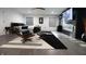 Contemporary main bedroom featuring a modern chair, sleek fireplace, and stylish decor at 3401 W Kessler Blvd N Dr, Indianapolis, IN 46222