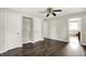 View of the dining room showcasing modern hard flooring, two closets with shelves and a ceiling fan at 3609 N Keystone Ave, Indianapolis, IN 46218