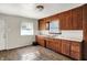 Classic kitchen with wood cabinetry, offering ample storage space, a double basin stainless sink and natural light at 3609 N Keystone Ave, Indianapolis, IN 46218