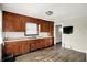 Traditional kitchen with wood cabinets, laminate countertops, and stainless steel sink overlooking the backyard at 3609 N Keystone Ave, Indianapolis, IN 46218