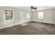 Bright living room featuring neutral walls and a ceiling fan, offering a blank canvas for personalization at 3609 N Keystone Ave, Indianapolis, IN 46218