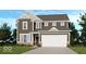 Charming two-story home featuring a two-car garage and classic architectural details at 367 N Post Oak Dr, Mooresville, IN 46158