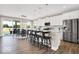 Spacious kitchen featuring white cabinets, an island with seating, and stainless steel appliances at 367 N Post Oak Dr, Mooresville, IN 46158
