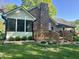 Well-manicured backyard featuring a spacious wooden deck, lush green lawn, and beautiful landscaping at 378 Turnberry Ct, Avon, IN 46123