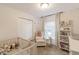 Cozy Bedroom with crib, soft carpet, changing table, and natural light from the window at 378 Turnberry Ct, Avon, IN 46123