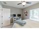Comfortable bedroom with a dedicated desk area and bright, overhead ceiling fan at 378 Turnberry Ct, Avon, IN 46123