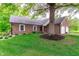 Traditional brick home with mature tree in the front yard and an attached two-car garage at 378 Turnberry Ct, Avon, IN 46123