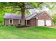 Charming brick ranch-style home with a well-manicured lawn and attached two car garage at 378 Turnberry Ct, Avon, IN 46123