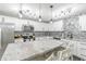 Lovely updated kitchen featuring stainless appliances, an island with marble countertop and lots of storage at 378 Turnberry Ct, Avon, IN 46123