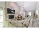 Bright living room featuring a stone fireplace, vaulted ceilings, and luxury vinyl flooring at 378 Turnberry Ct, Avon, IN 46123