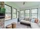 Cozy sunroom with sectional sofa, neutral tones, lots of windows and view of backyard at 378 Turnberry Ct, Avon, IN 46123