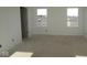 Unfinished bedroom featuring neutral walls and natural light from two windows at 3942 Seeger St, Indianapolis, IN 46239