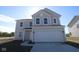 Charming two-story home with a two-car garage and classic architectural details at 3942 Seeger St, Indianapolis, IN 46239