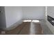 Unfinished living room featuring a modern fireplace and bright natural light at 3942 Seeger St, Indianapolis, IN 46239