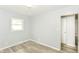 Bedroom with light walls, vinyl flooring, and natural light at 4013 Priscilla Ave, Indianapolis, IN 46226