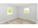 Bright bedroom with two windows and light colored flooring at 4013 Priscilla Ave, Indianapolis, IN 46226