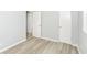 Bedroom with wood flooring, two closets, and fresh paint at 4013 Priscilla Ave, Indianapolis, IN 46226
