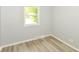 Bedroom features fresh paint, luxury vinyl, and a window at 4013 Priscilla Ave, Indianapolis, IN 46226