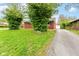 A long, paved driveway leads to the home and a detached garage at 4013 Priscilla Ave, Indianapolis, IN 46226