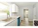 Bright kitchen with stainless steel sink and white cabinetry at 4013 Priscilla Ave, Indianapolis, IN 46226