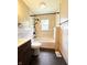 Modern bathroom features a shower-tub combo and wood vanity at 406 Frst Pk N Dr, Greenwood, IN 46142