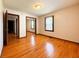 Bright bedroom featuring wood floors and a closet with mirrored doors at 406 Frst Pk N Dr, Greenwood, IN 46142