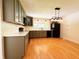 Updated kitchen features gray cabinets, stainless appliances, and wood flooring at 406 Frst Pk N Dr, Greenwood, IN 46142