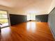 Bright and airy living room boasting gleaming hardwood floors and access to the outdoors at 406 Frst Pk N Dr, Greenwood, IN 46142