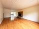 Spacious living room featuring wood flooring and a brick fireplace at 406 Frst Pk N Dr, Greenwood, IN 46142