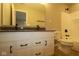 Bathroom featuring dual sinks with black hardware, vanity, toilet, and combination tub and shower at 4075 Persian St, Greenwood, IN 46143