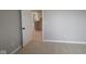 Bedroom with carpet, neutral walls and base trim and an open door way at 4075 Persian St, Greenwood, IN 46143
