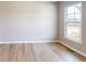 Bedroom features hard wood floors and a window showing neighborhood views at 4075 Persian St, Greenwood, IN 46143