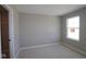 Cozy bedroom with soft carpeting and a walk-in closet, enhanced by natural light from a nearby window at 4075 Persian St, Greenwood, IN 46143