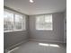 Bedroom with carpet, neutral walls and base trim with two windows at 4075 Persian St, Greenwood, IN 46143