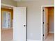 Bedroom features neutral carpet and white doors leading to closet at 4075 Persian St, Greenwood, IN 46143